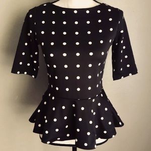 Elbow length black and white peplum top